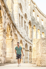Fototapeta premium young man at the Pula Arena Croatia