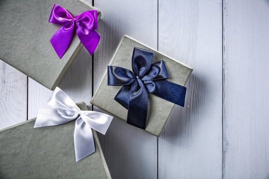 Christmas gifts on white wooden table and pfoto from above. 