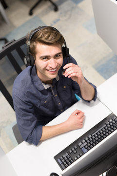 male call centre operator doing his job top view