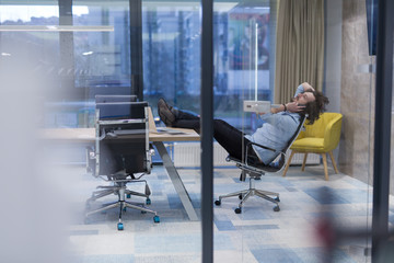 young businessman relaxing at the desk