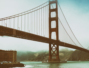 San Francisco Golden Gate Bridge on a foggy day from Fort Point