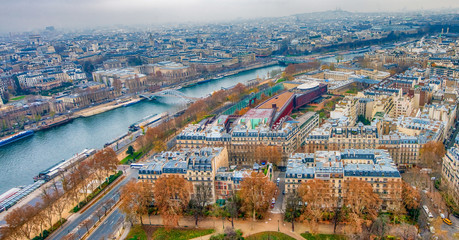 Paris aerial skyline with Seine river on a cloudy winter day, Fr