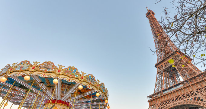 The Eiffel Tower and Merry-Go-Round wheel at sunset, Paris - France