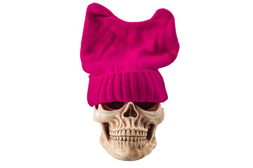 Tough and scary liberal feminist concept with a skull wearing a pink pussy hat isolated on white...