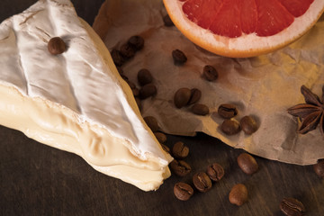 white cheese or cake dessert with coffee beans grapefruit and anise