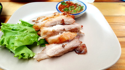 Roast pork and slices isolated on white Chili and fish sauce