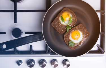 toasted scrambled eggs  cooking in a frying  pan.