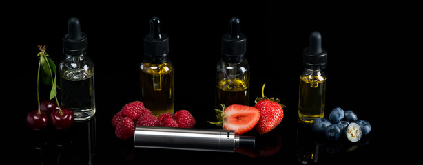 bottles with berry tastes stand on a dark background, liquid for an electronic cigarette, a long photo