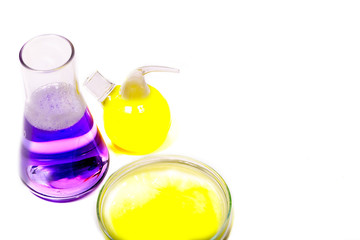 Beaker and retort with green and blue with a chemical reagent. Chemical experiment with Laboratory glass