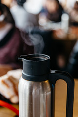 Steam from hot tea in pot at the restaurant in Hokkaido, Japan.