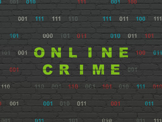 Protection concept: Painted green text Online Crime on Black Brick wall background with Binary Code