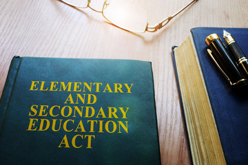 Elementary and Secondary Education Act of 1965 (ESEA) on a desk.