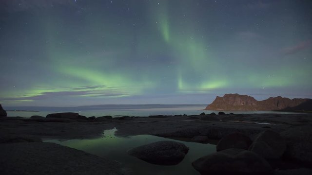 Aurora over the sea timelapse at Utakleiv beach, Lofoten Islands, Norway