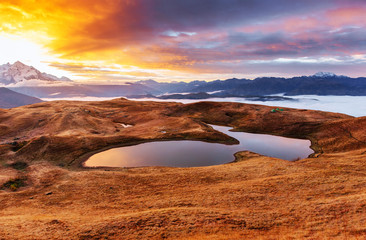 Mountain Lake. Beautiful sunrise. Morning landscape. Koruldi Lake. Main Caucasian ridge