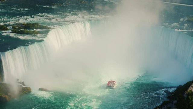 A waterfall in the shape of a horseshoe on the Niagara River. Top view of the incredible Niagara Falls. 4k 10 bit video