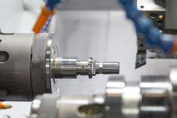 CNC lathe machine or Turning machine drilling  the steel rod .Hi technology manufacturing process.