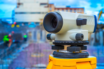 Theodolite is a measuring device for determining horizontal and vertical angles. Construction site.