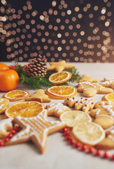 Decorating a spicy cookie with white glaze and orange. Happy New Year.