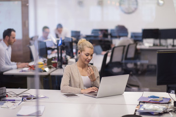 businesswoman using a laptop in startup office
