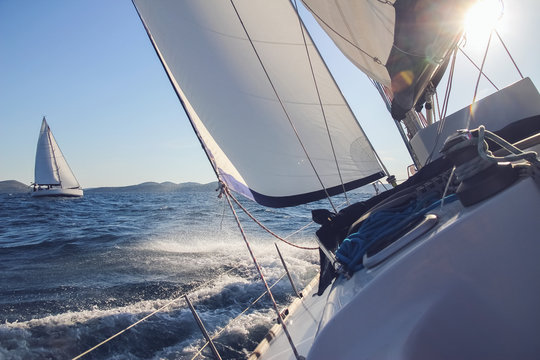 Sailing in the wind through the waves, yachts at sailing regatta © michalsanca