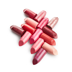 Broken lipsticks isolated on white background