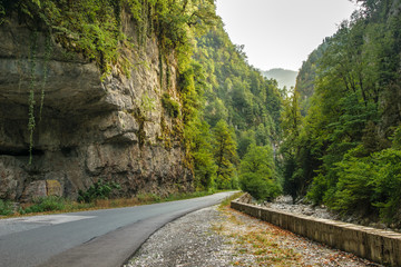 Good asphalt road through gorge along Bzyb river near Ritsa lake in Abkhazia