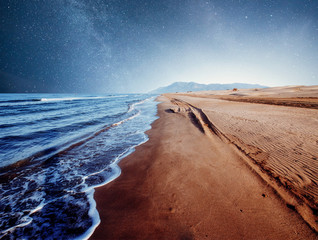 Amazing Panoramic Landscape view of a Milky Way at night sky, with grain