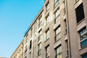 Fototapeta premium grey modern apartments with clean blue sky