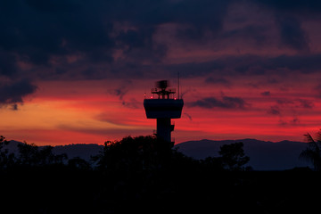 Rotating antenna secondary surveillance radar with twilight sky at sunset time