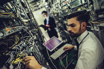 Man and woman in data centre