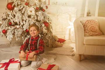 Young boy at home on Christmas evening