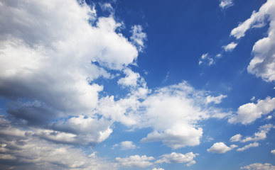 Grey clouds in the blue sky