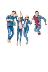 Obraz premium happy young friends jumping together