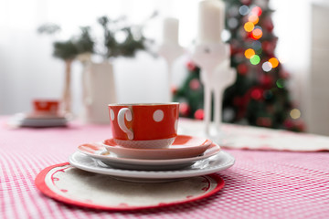 Interior light grey kitchen and red christmas decor. Preparing lunch at home on the kitchen concept.