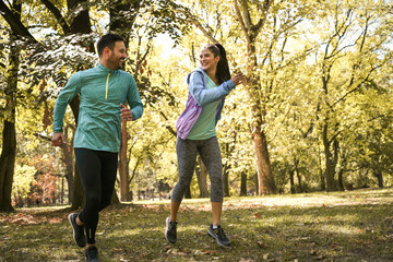 Happy couple exercise together outdoor.