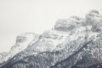 Fototapeta na wymiar Aerial view on the mountains covered in snow, Trentino, Italy, Europe