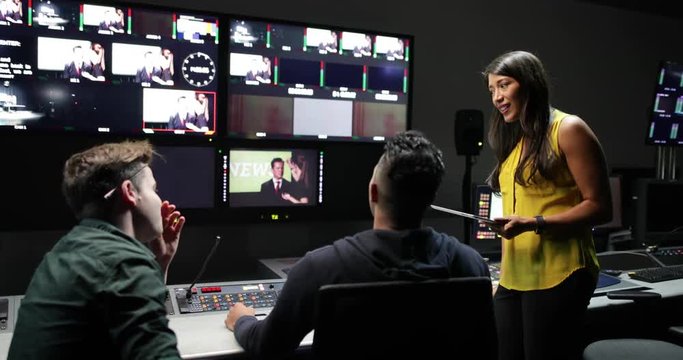 TV crew having meeting in control room