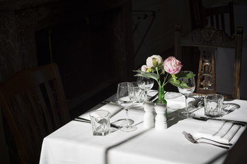Sunlit formal restarant place setting