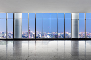 empty office with modern cityscape at twilight
