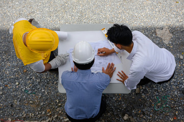 Top view of engineering team reading plan
