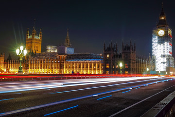 Fototapeta na wymiar Night scene with light trails on the Westminster bridge. Big Ben and House of Parliament in London, The United Kingdom of Great Britain.