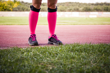 Fototapeta premium female legs wearing sport equipment