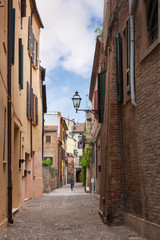 Ferrara, old narrow street, Italy