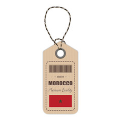 Hang Tag Made In Morocco With Flag Icon Isolated On A White Background. Vector Illustration. Made In Badge. Business Concept. Buy products made in Morocco. Use For Brochures, Printed Materials, Logos