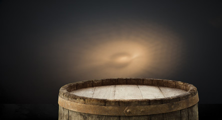 Fototapeta premium Old wood table top with smoke in the dark background.