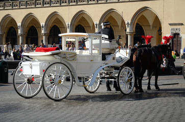Fototapeta na wymiar Cab on the main square - old town in Krakow, Poland