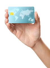 Woman's hand holding credit card on white background