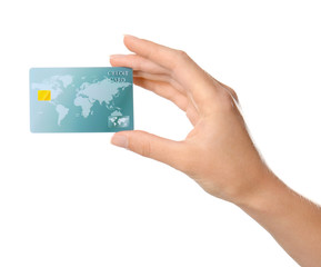 Woman's hand holding credit card on white background