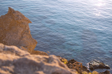 Sea rocks and the old chair
