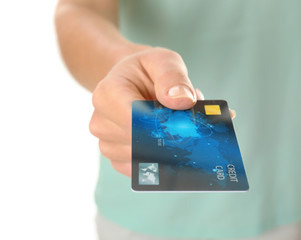 Woman holding credit card on white background